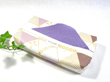 Load image into Gallery viewer, Cotton dispenser box in a Geometric pattern with 12 Lilac cotton handkerchiefs folded inside
