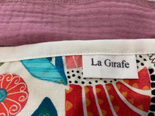 Load image into Gallery viewer, Closeup Cotton dispenser box in a brightly coloured pattern with 12 Pink cotton handkerchiefs