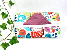 Load image into Gallery viewer, Cotton dispenser box in a brightly coloured pattern with 12 Pink cotton handkerchiefs folded inside