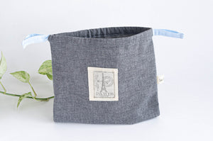Grey Chambray square bag with printed off-white logo showing Eiffel Towel