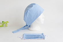 Load image into Gallery viewer, Side view of a Blue Cloth Scrub hat with a matching blue face mask
