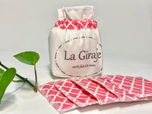 Charger l&#39;image dans la galerie, An Ivory cotton pouch with a stack of Salmon patterned makeup remover pads
