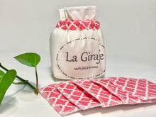 Charger l'image dans la galerie, An Ivory cotton pouch with a stack of Salmon patterned makeup remover pads