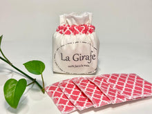 Charger l'image dans la galerie, An Ivory cotton pouch with a stack of Salmon patterned makeup remover pads