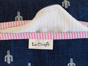 Closeup of a Denim with Cactus pattern box dispenser with Pink trim
