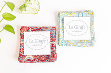 Charger l&#39;image dans la galerie, A Set of 4 Red Paisley and a set of Green Paisley napkins folded in a square
