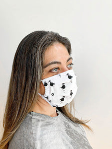 Woman wearing a face mask to show actual size and it on a face 