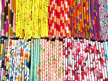 Charger l'image dans la galerie, A large variety of colourful folded towels in many patterns and colours