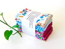Load image into Gallery viewer, A stack of folded towels with Butterfly, Checks and Garden patterns
