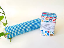 Charger l'image dans la galerie, A stack of folded towels with Butterfly, Checks and Garden patterns with a rolled towel