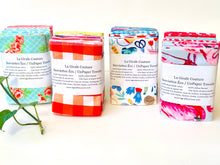 Charger l'image dans la galerie, Four stacks of folded towels in a range of patterns in a large assortment of colours