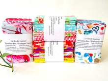 Charger l'image dans la galerie, Four stacks of folded towels in a range of patterns in a large assortment of colours