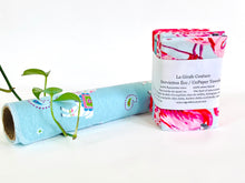 Charger l'image dans la galerie, A stack of folded towels with Flamingo, Lamas and Polka Dots patterns next one rolled towel