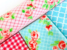 Charger l'image dans la galerie, Closeup of three folded and one rolled towels with Roses and Checks patterns in Blue and Pink