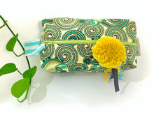 Load image into Gallery viewer, Top view of rectangular Cosmetic bag with Green Paisley printed pattern and Yellow Pompon