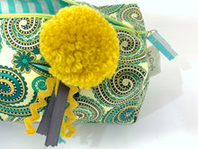 Load image into Gallery viewer, Closeup of rectangular Cosmetic bag with Green Paisley printed pattern and Yellow Pompon
