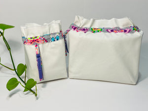 Two bags in off-white cotton with a Butterfly trim. One bag is big and one small