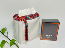 Charger l'image dans la galerie, One small bag in off-white cotton canvas with a Red Paisley trim next to a bottle of perfume