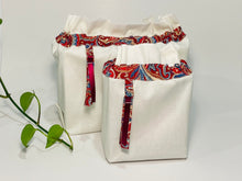 Load image into Gallery viewer, Two bags in off-white cotton with a Red Paisley trim. One bag is big and one small.
