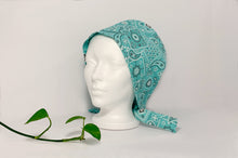 Load image into Gallery viewer, Left view of Aqua Western Paisley Scrub Cap