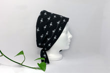 Load image into Gallery viewer, Right view of Scrub Cap with White Flamingo print on Black ground