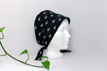 Load image into Gallery viewer, Semi Right view of Scrub Cap with White Flamingo print on Black ground