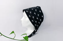Load image into Gallery viewer, Left view of Scrub Cap with White Flamingo print on Black ground
