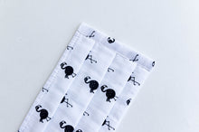 Load image into Gallery viewer, Closeup of Face mask with White ground and Black Flamingo print
