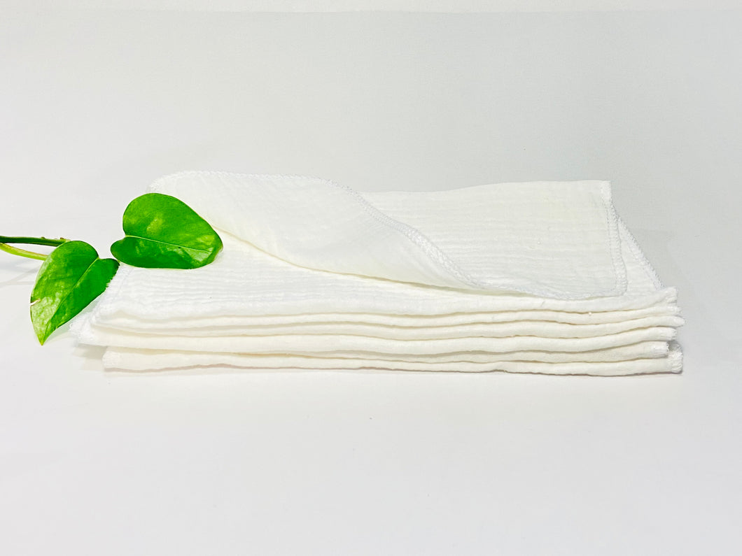 12 White cotton handkerchiefs folded in two