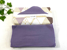 Charger l&#39;image dans la galerie, Cotton dispenser box in a Geometric pattern with 12 Lilac cotton handkerchiefs folded next to box
