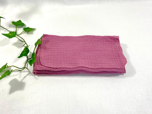 12 Pink cotton handkerchiefs folded in half