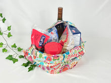 Load image into Gallery viewer, Cotton bag with handle with a floral pattern with vibrant colors with grocery in it
