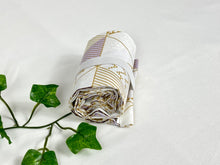 Load image into Gallery viewer, Rolled Cotton bag with a geometric pattern with beige and lilac shades
