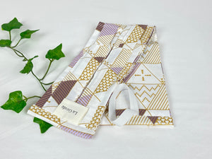 Flat Cotton bag with a geometric pattern with beige and lilac shades