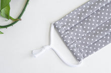 Load image into Gallery viewer, Closeup of One face mask pleated, Grey ground with White Polka Dots
