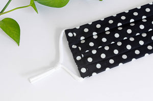 Close up of Cotton cloth face mask, White Polka Dots on Black Ground
