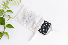 Load image into Gallery viewer, Ivory Cotton pouch with 100% handmade printed logo and containing a folded cotton face mask
