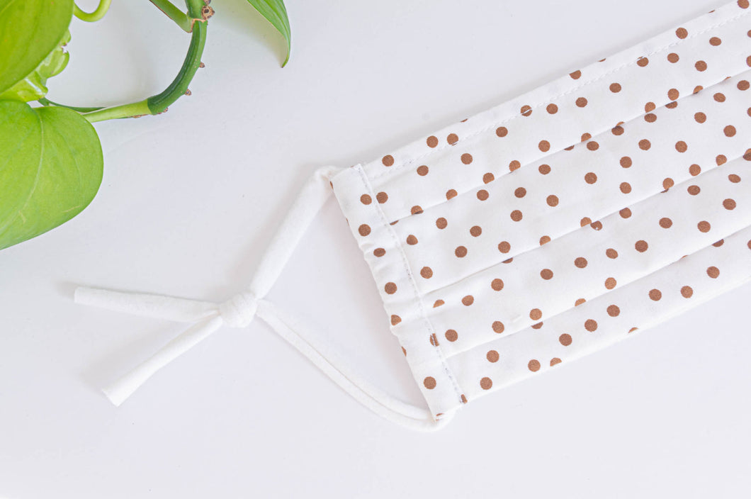 Close up of Cotton cloth face mask, Coffee Polka Dots on Ivory ground