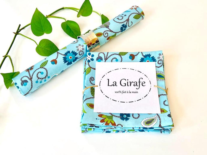 One folded and one rolled napkin with a Floral pattern on Blue Ground