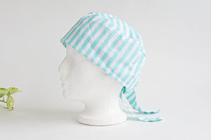 Left Side view of scrub hat with Aqua Stripes on White