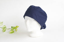 Load image into Gallery viewer, Left side view of Scrub hat White Polka Dots on Navy
