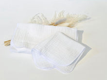 Load image into Gallery viewer, A stack of 12 white cotton handkerchiefs
