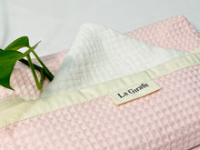 Load image into Gallery viewer, Close up of White coton handkerchiefs with a Pink Waffle dispenser box
