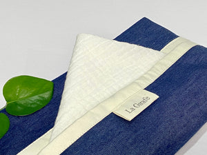 Close up of White Cotton handkerchiefs with Blue Denim box dispenser