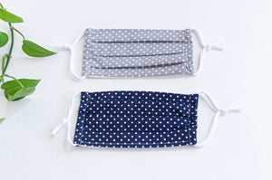 Two face face masks, one Navy ground and White Polka Dots, one Grey grey ground and White Polka Dots