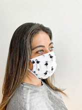 Load image into Gallery viewer, Woman wearing a face mask t show size and fit on face
