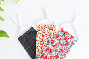 Three Cotton cloth Pleated face masks, one Red Stars, one Orange Bubbles and one Black Denim