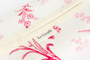 Close up of a cotton dispenser box with a Toile de Jouy pattern with a La Girafe label
