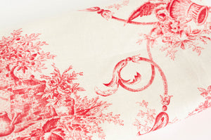 Close up of the Toile de Jouy pink pattern on an off white ground