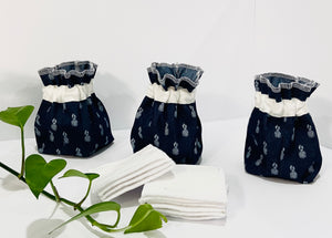 Three Pouches made of Denim with Pineapple pattern with a stack of white makeup remover pads